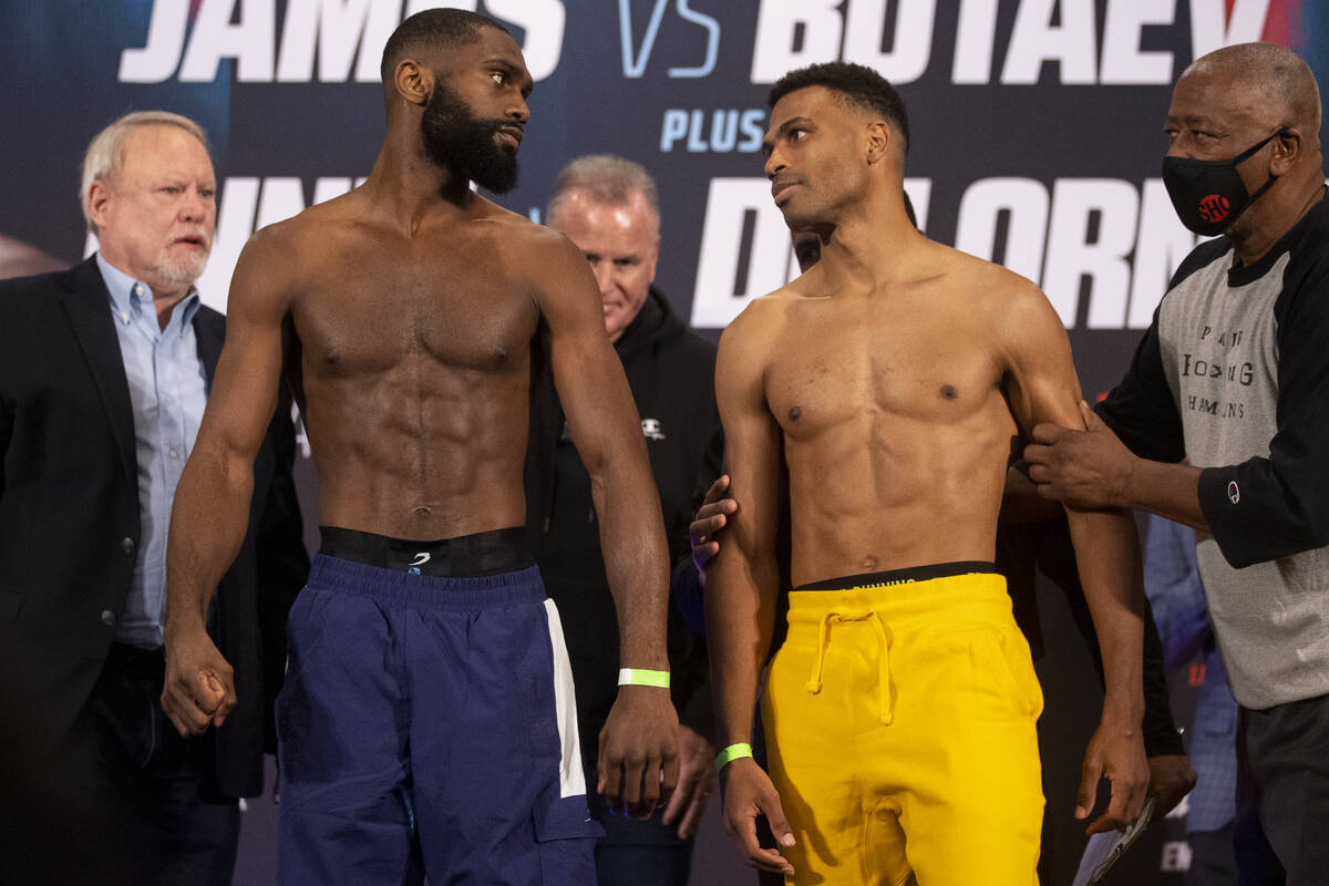 Jaron Ennis, left, and Thomas Dulorme, face off during their weigh in at the Michelob Ultra Are ...