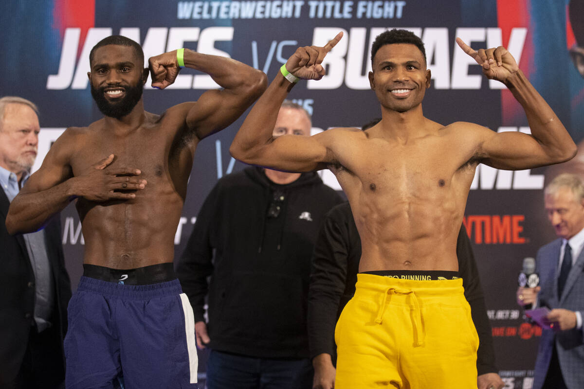 Jaron Ennis, left, and Thomas Dulorme, pose during their weigh in at the Michelob Ultra Arena i ...