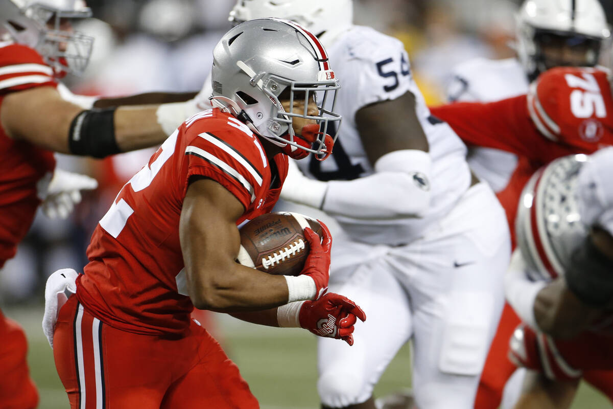 Ohio State running back TreVeyon Henderson runs the ball against Penn State during the first ha ...
