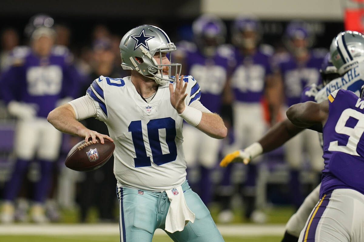 Dallas Cowboys quarterback Cooper Rush (10) looks to pass during the second half of an NFL foot ...