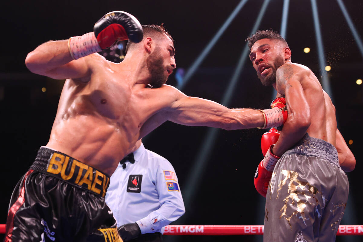 Radzhab Butaev, left, connects a punch against Jamal James in the eight round of the WBA World ...