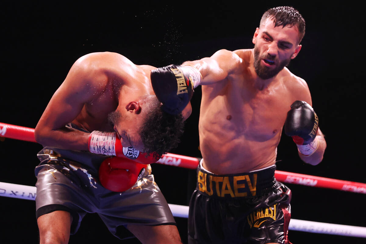 Radzhab Butaev, right, connects with a punch against Jamal James in the sixth round of the WBA ...