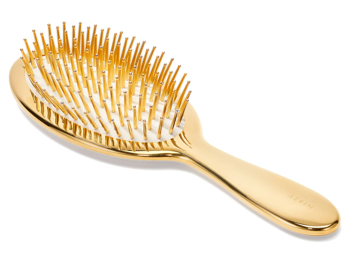 5. Aerin Large Gold Hairbrush Bye-bye bad hair days! This 24-karat gold-coated brush makes for ...