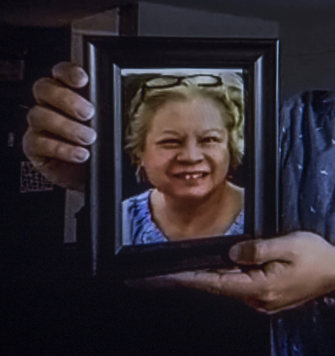 Roderick Alimusa holds a photograph of his mother Maria Alimusa who died at the Heights of Summ ...