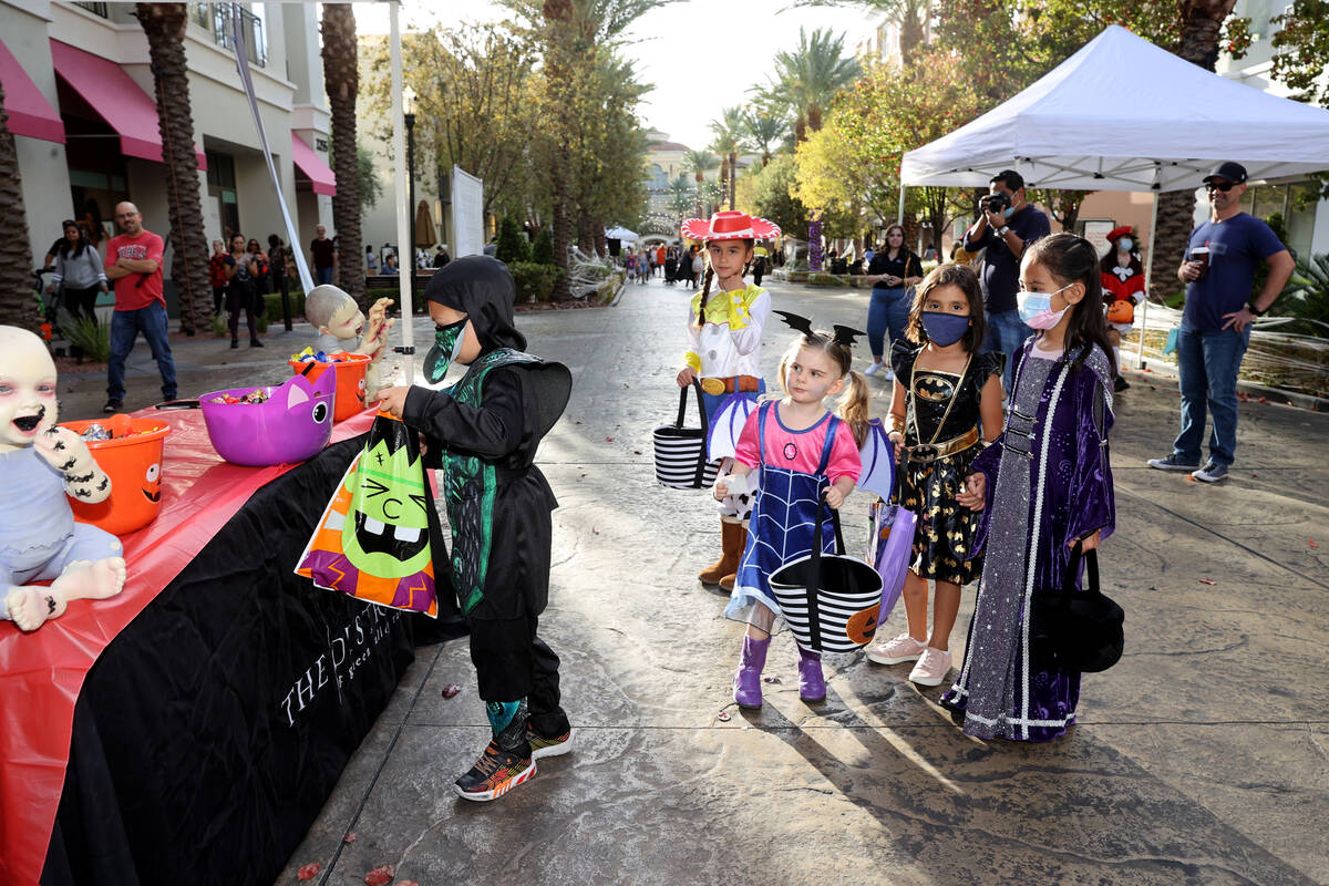 Kids in costume during the Halloween Ghost Walk at The District at Green Valley Ranch in Hender ...