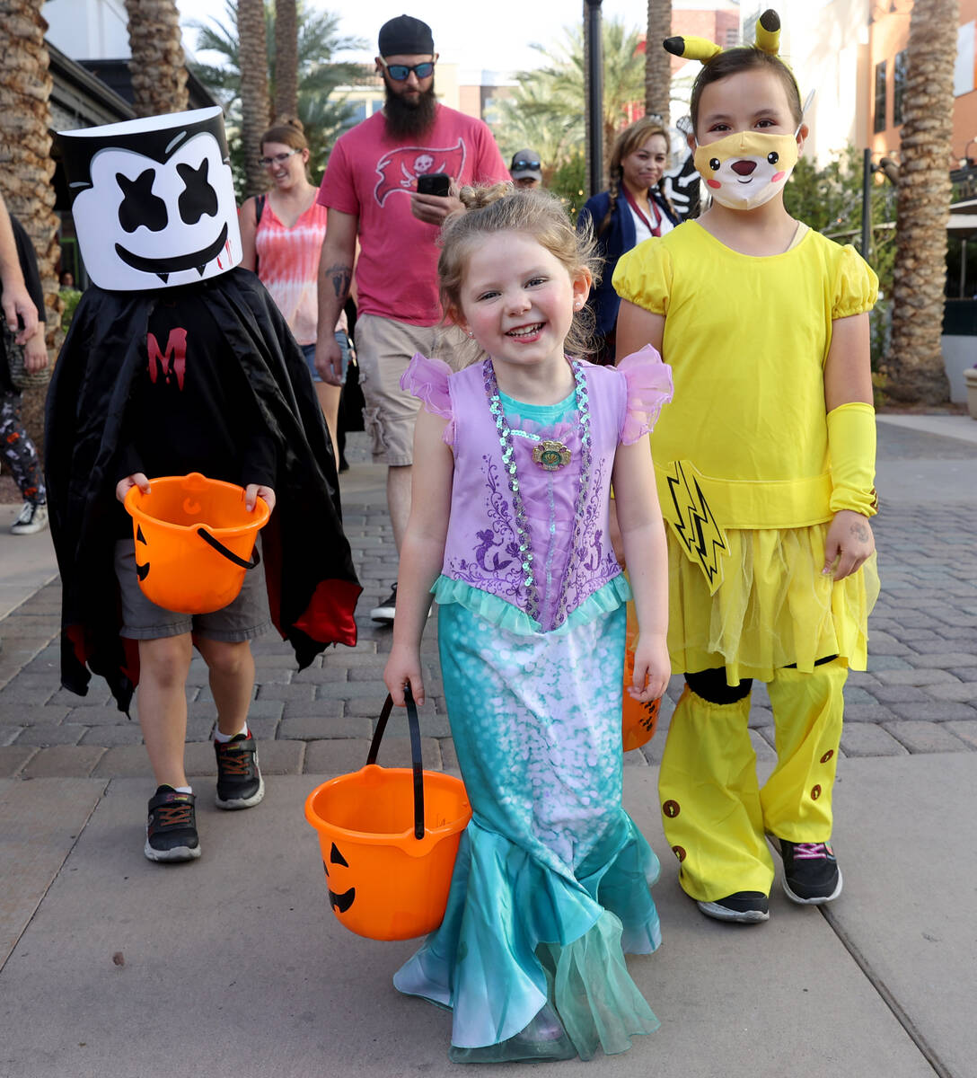 Autumn Manosh, 5, of Henderson, center, during the Halloween Ghost Walk at The District at Gree ...