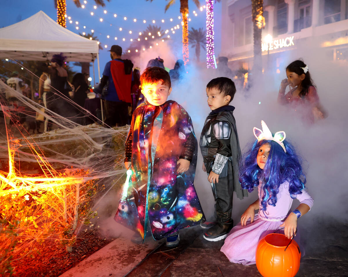 Luca Vescio, 3, from left, Alessandro Mannozzi, 3, and Noelle Castro, 5, during the Halloween G ...