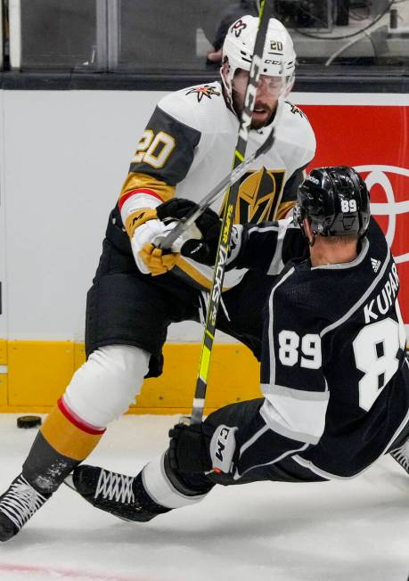 Los Angeles Kings center Rasmus Kupari (89) hits the ice battling Vegas Golden Knights center C ...