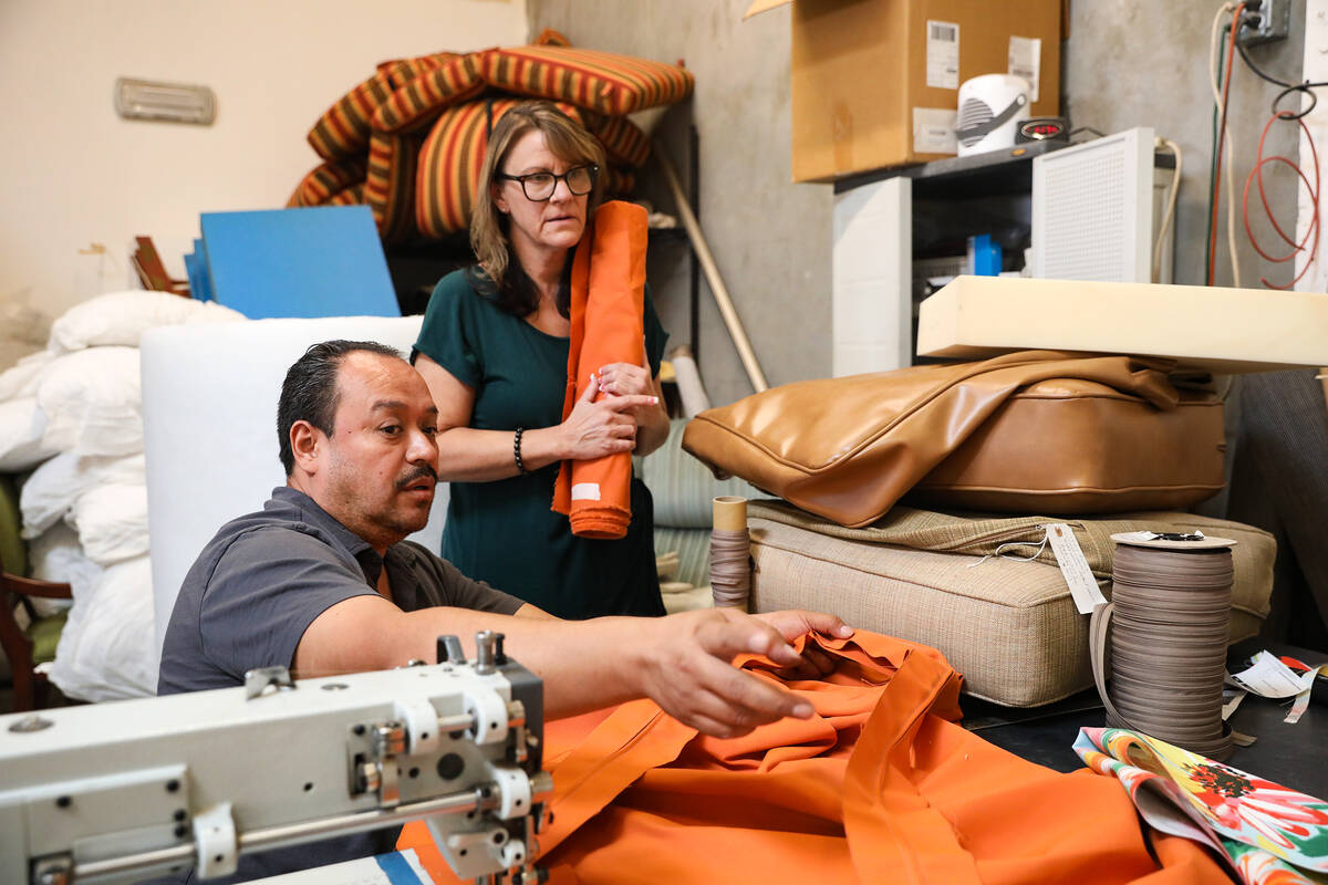 Jaime Molina, left, discusses a project with officer manager Jennifer Jackson, right, at Summer ...