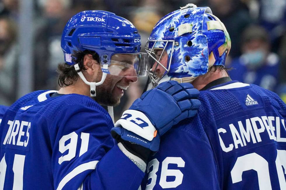 Toronto Maple Leafs forward John Tavares (91) congratulates goaltender Jack Campbell (36) after ...