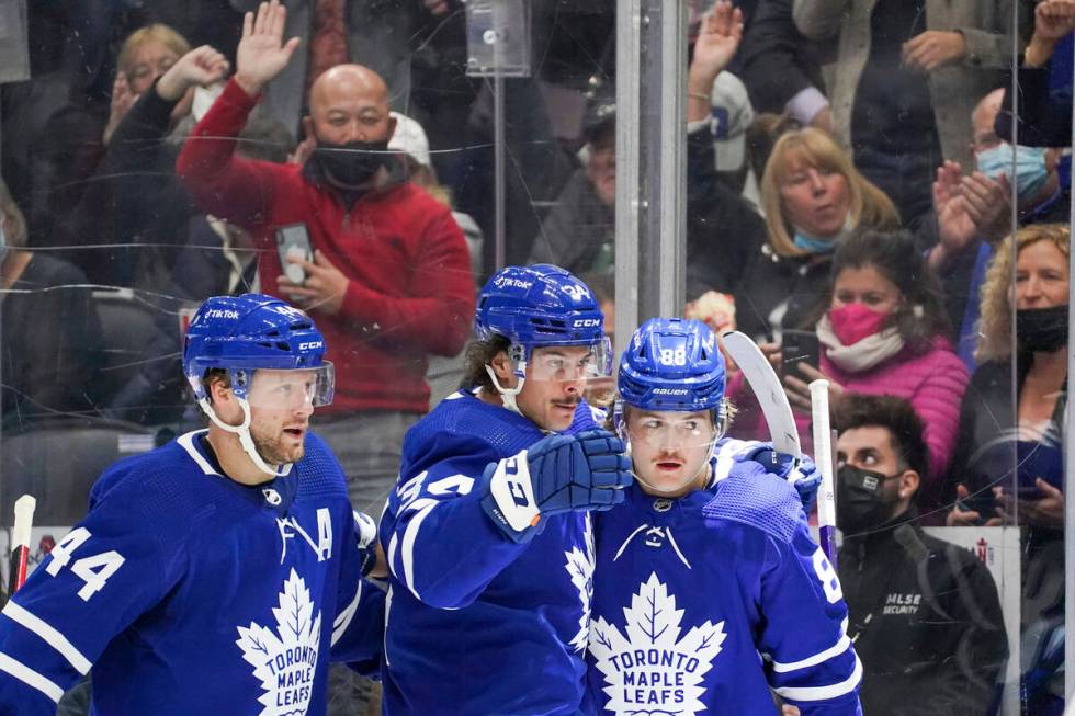 Toronto Maple Leafs' Morgan Rielly (44), Auston Matthews (34) and William Nylander (88) celebra ...