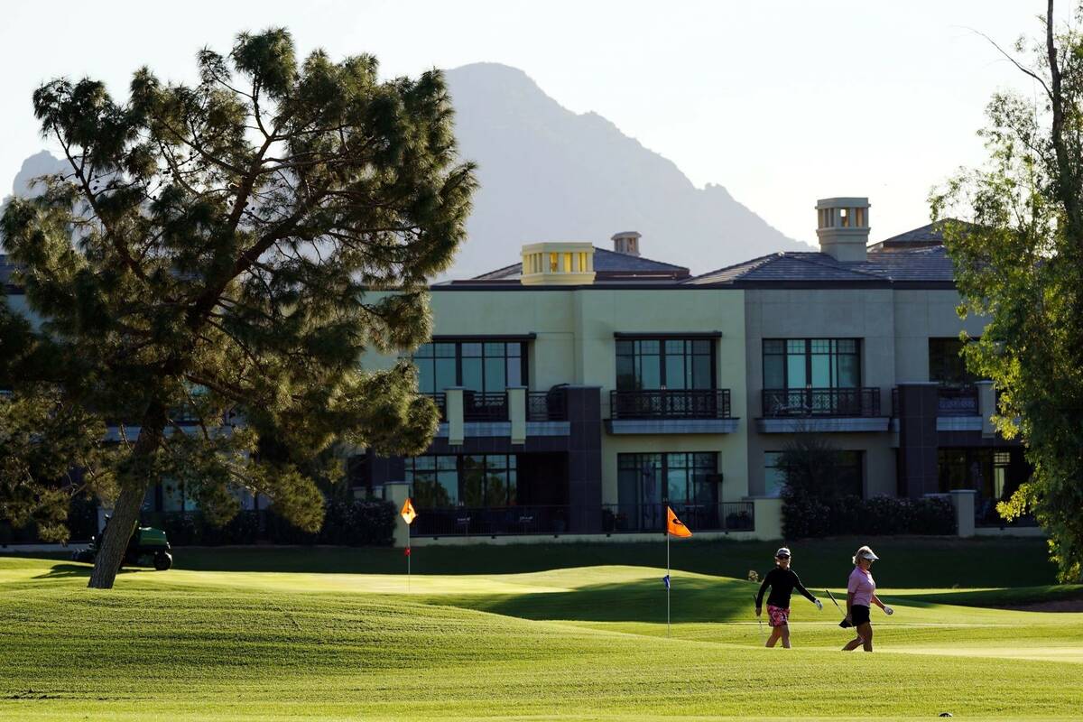 Golfers at the Arizona Biltmore resort walk off a green Wednesday, Oct. 27, 2021, in Phoenix. ( ...