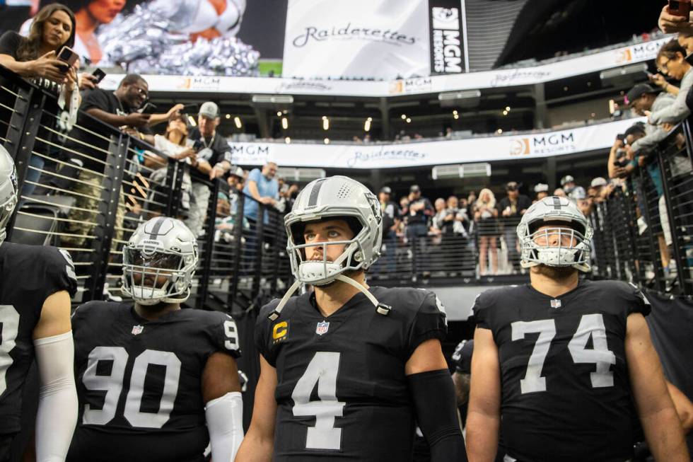 Raiders quarterback Derek Carr (4) waits to lead his team onto the field before the start of an ...