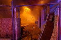Las Vegas firefighters were battling a blaze at a vacant apartment building in downtown Las Veg ...