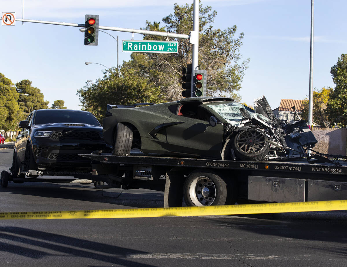 Raiders wide receiver Henry Ruggs' vehicle that was involved in a crash, front, and a Dodge Dur ...