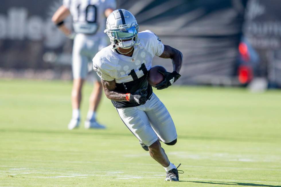 Raiders wide receiver Henry Ruggs III (11) runs with the football after making a catch during t ...