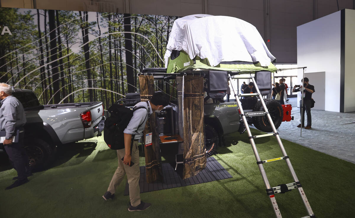 An attendee checks out a a Toyota Tacoma short bed with a TRD sport trailer during the Specialt ...