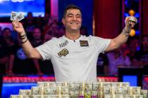 Hossein Ensan, from Germany, celebrates after winning the World Series of Poker Main Event on W ...