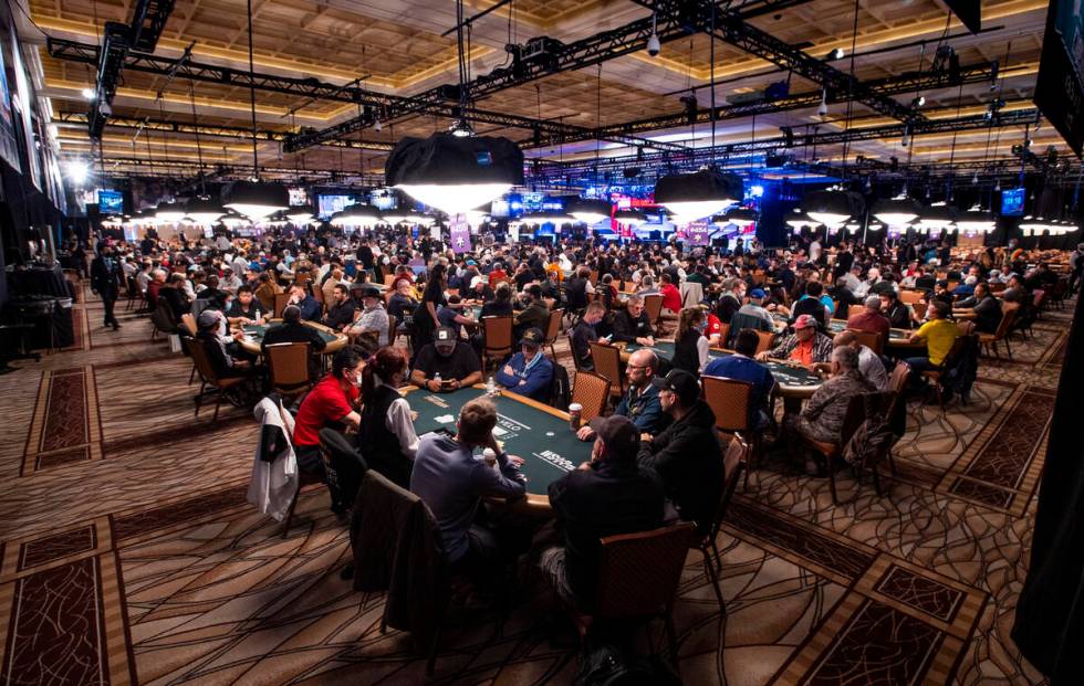 Players and dealers around the tables during Day 1A of the $10,000 buy-in Main Event at the Wor ...