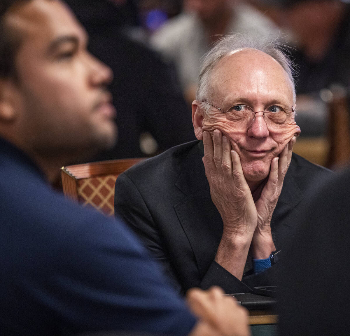 A player looks on as others bet a hand during Day 1A of the $10,000 buy-in Main Event at the Wo ...