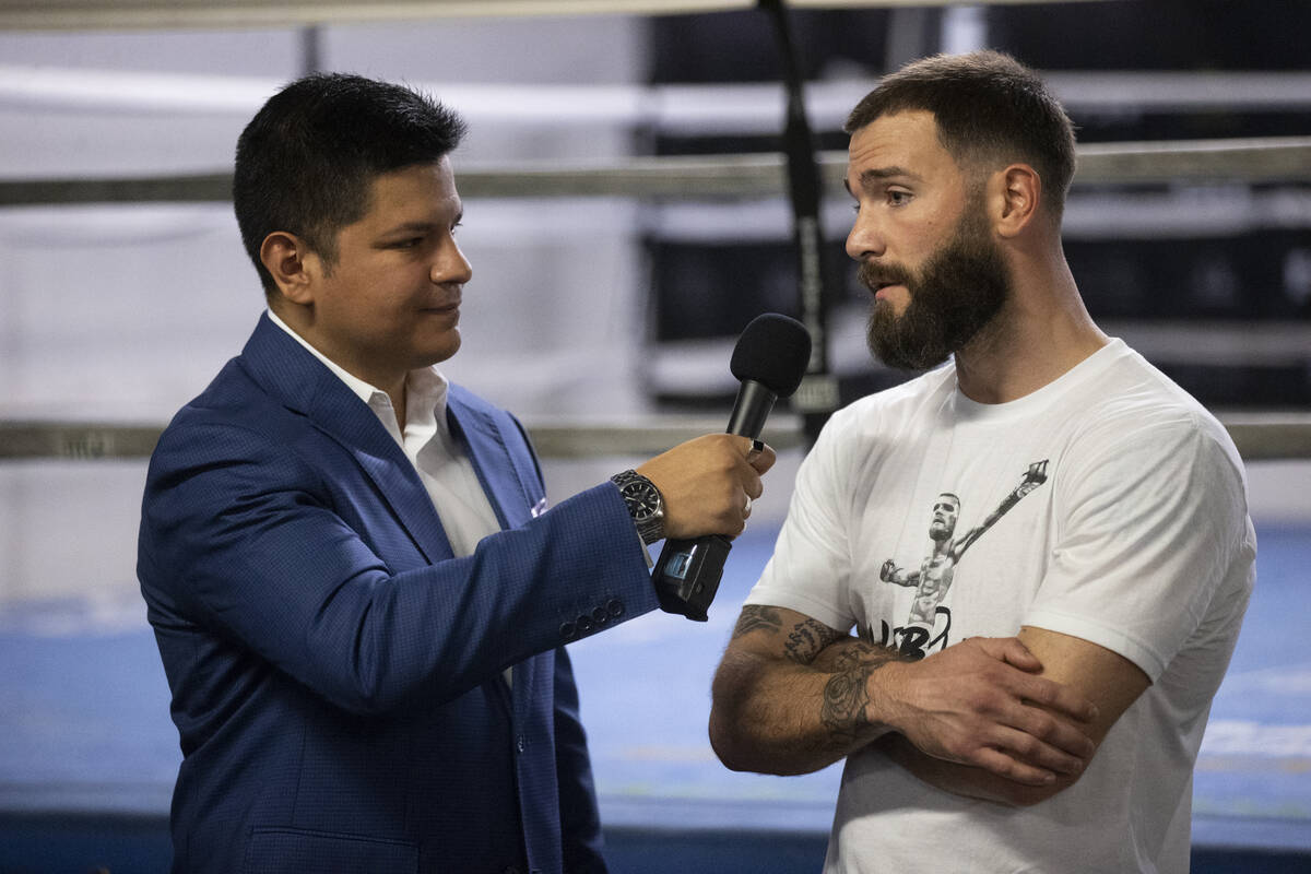 Boxing announcer Ray Flores, left, interviews Caleb Plant at the City Boxing Club in Las Vegas ...