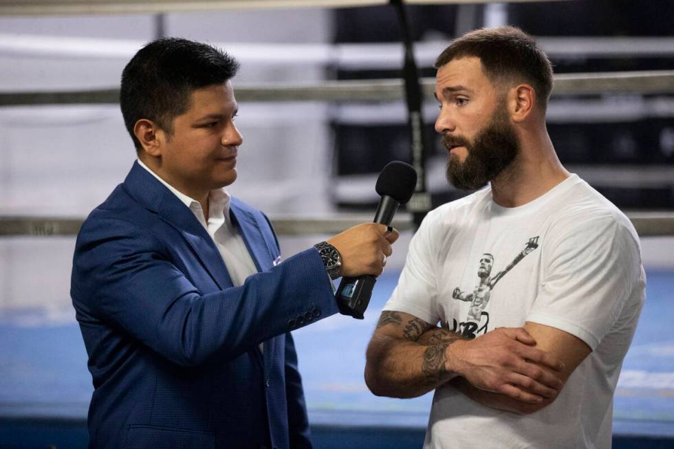 Boxing announcer Ray Flores, left, interviews Caleb Plant at the City Boxing Club in Las Vegas ...