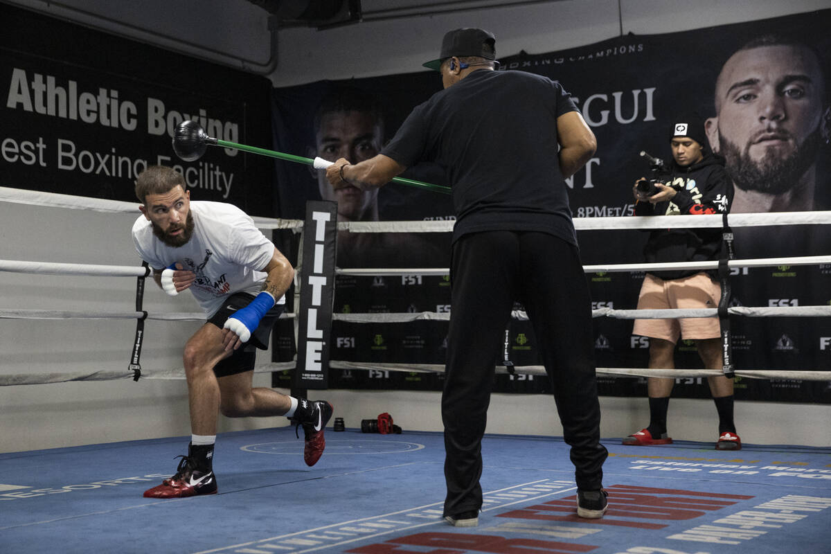 Caleb Plant, left, works on his defense with cutman Don House, at the City Boxing Club in Las V ...