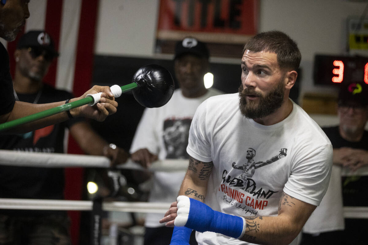 Caleb Plant, right, works on his defense with cutman Don House, at the City Boxing Club in Las ...