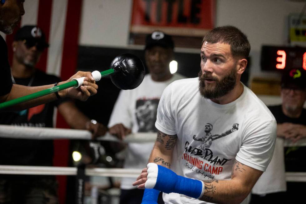 Caleb Plant, right, works on his defense with cutman Don House, at the City Boxing Club in Las ...