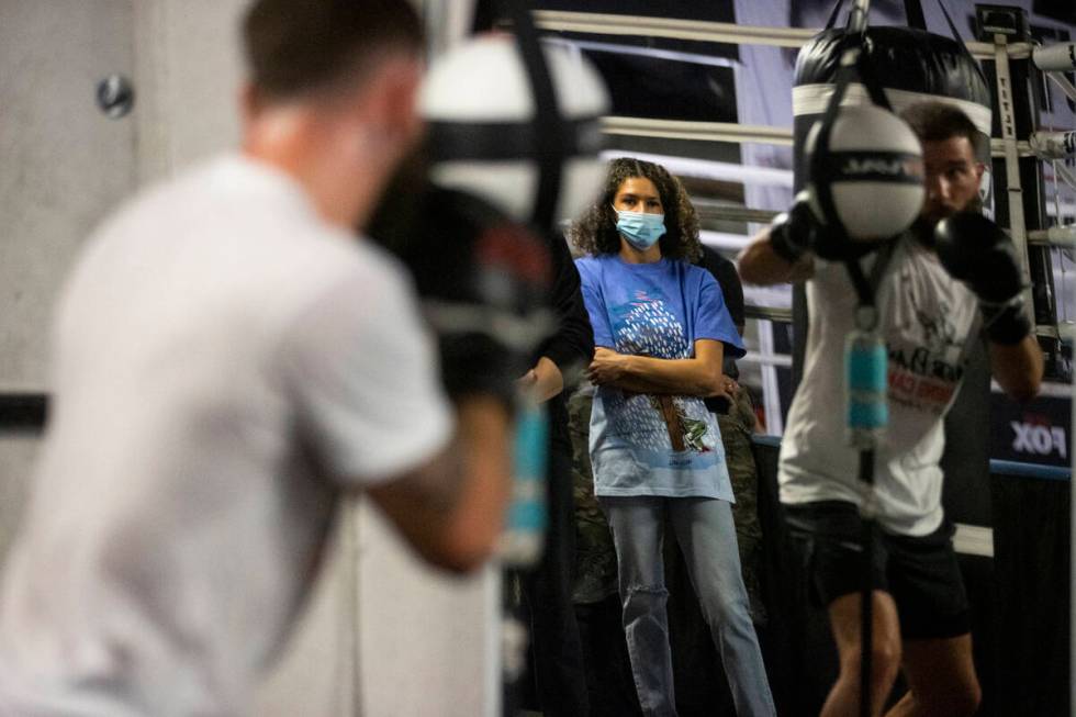 Jordan Plant, wife of boxer Caleb Plant, watches her husband workout in preparation for his upc ...