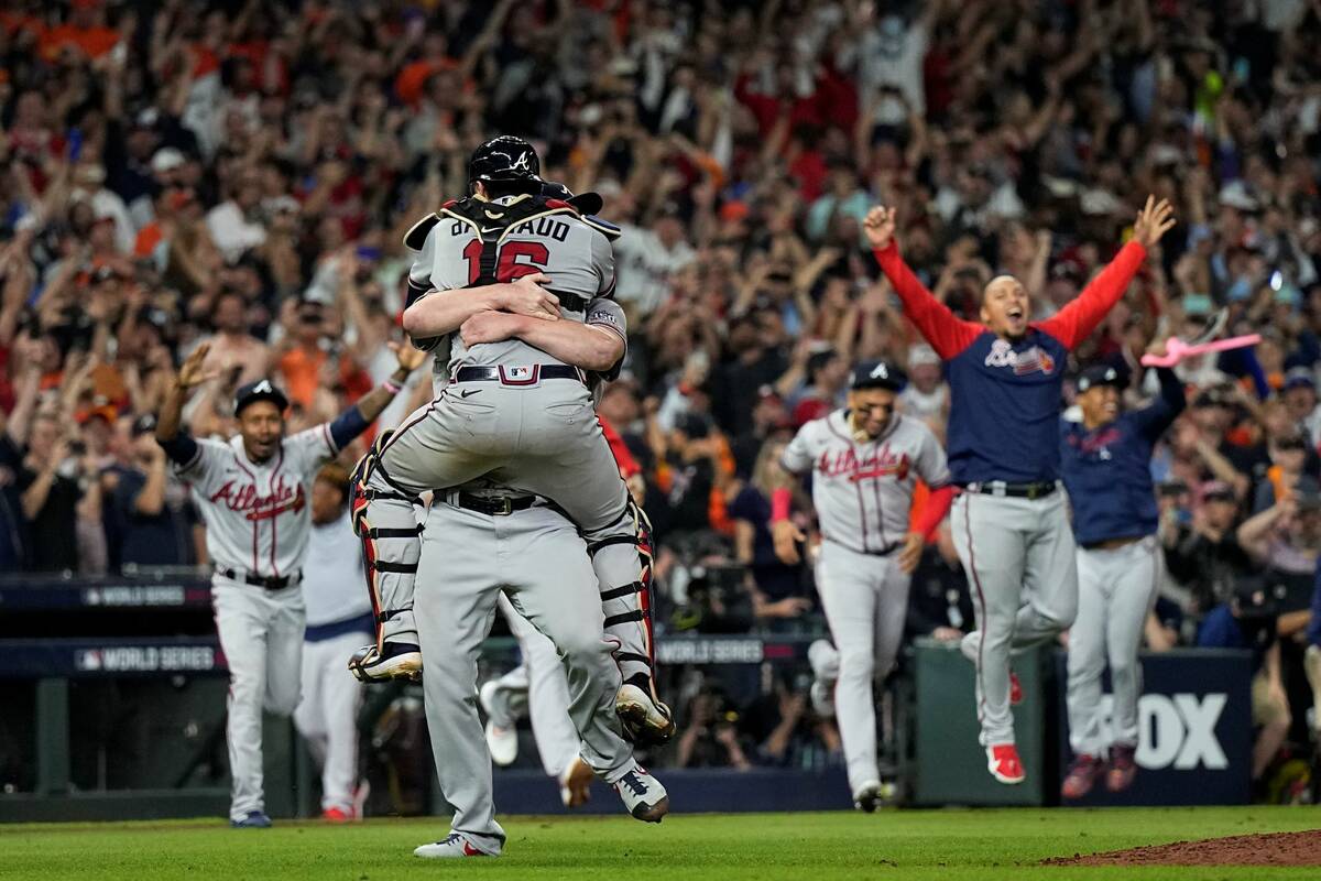 The Atlanta Braves celebrate after winning baseball's World Series in Game 6 against the Housto ...