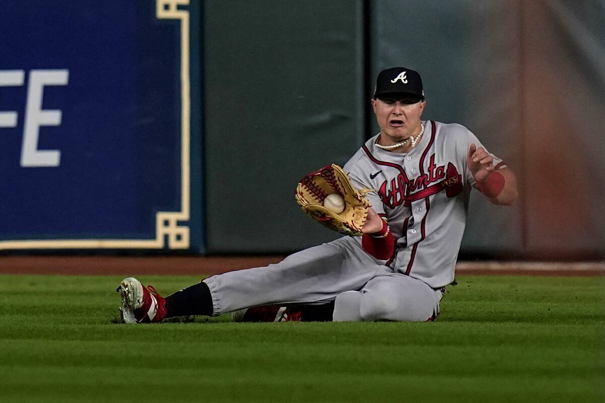 Atlanta Braves right fielder Joc Pederson catches a fly ball hit by Houston Astros' Kyle Tucker ...