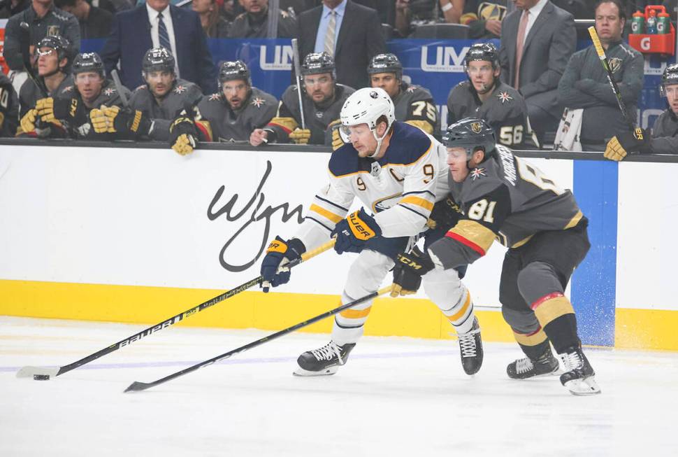 Buffalo Sabres center Jack Eichel (9) and Vegas Golden Knights center Jonathan Marchessault (81 ...