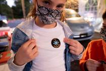 Leah Lefkove, 9, shows off her vaccination sticker just before being the first child to be vacc ...