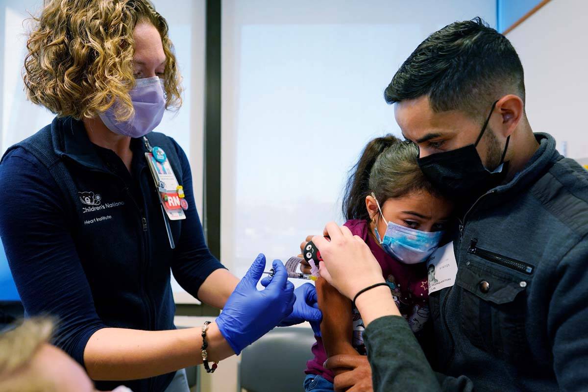 Kidney transplant patient Sophia Silvaamaya, 5, held by her father Pedro Silvaamaya, is vaccina ...