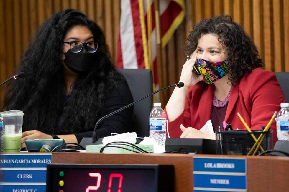 Board of Trustees clerk Evelyn Garcia Morales asks questions next to board vice president Irene ...