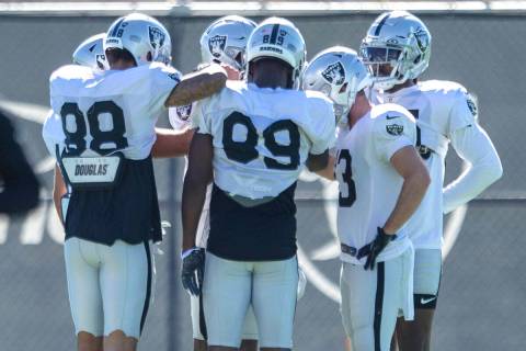 The Raiders wide receivers gather to a huddle prior to a practice session at the Raiders Headqu ...