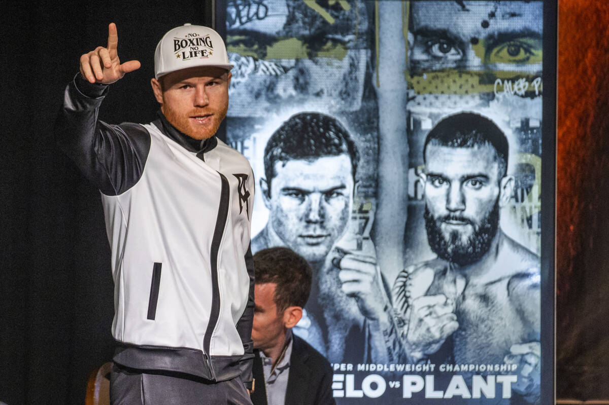 Boxer Canelo Alvarez greets the audience gathered during the final press conference for Caleb P ...