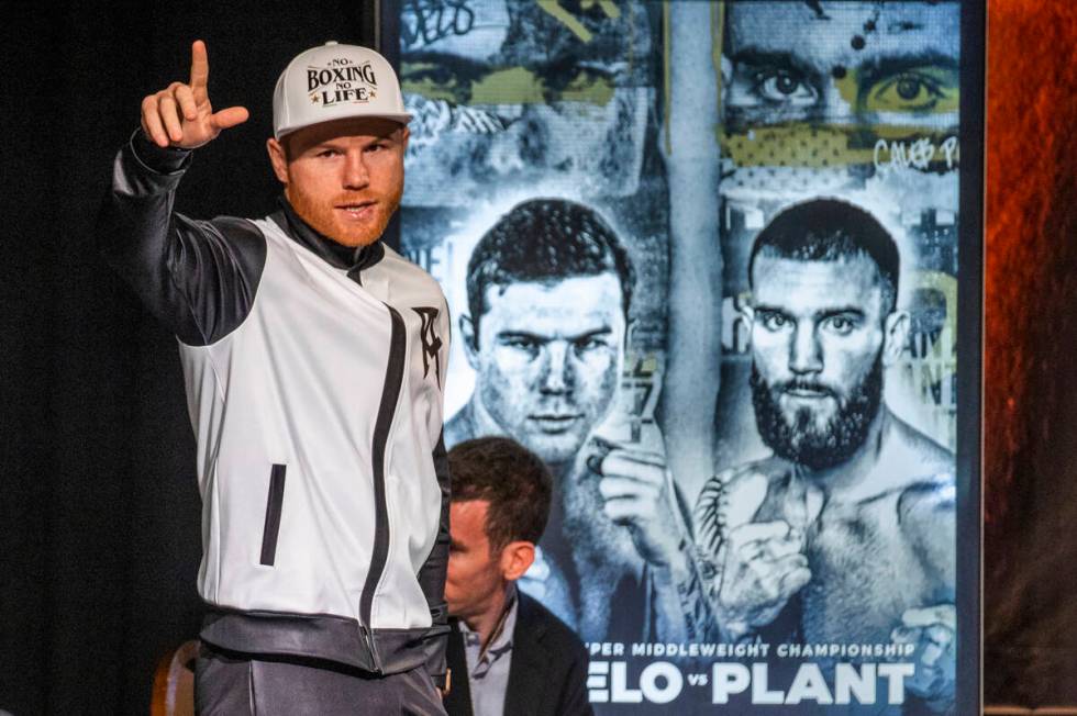 Boxer Canelo Alvarez greets the audience gathered during the final press conference for Caleb P ...