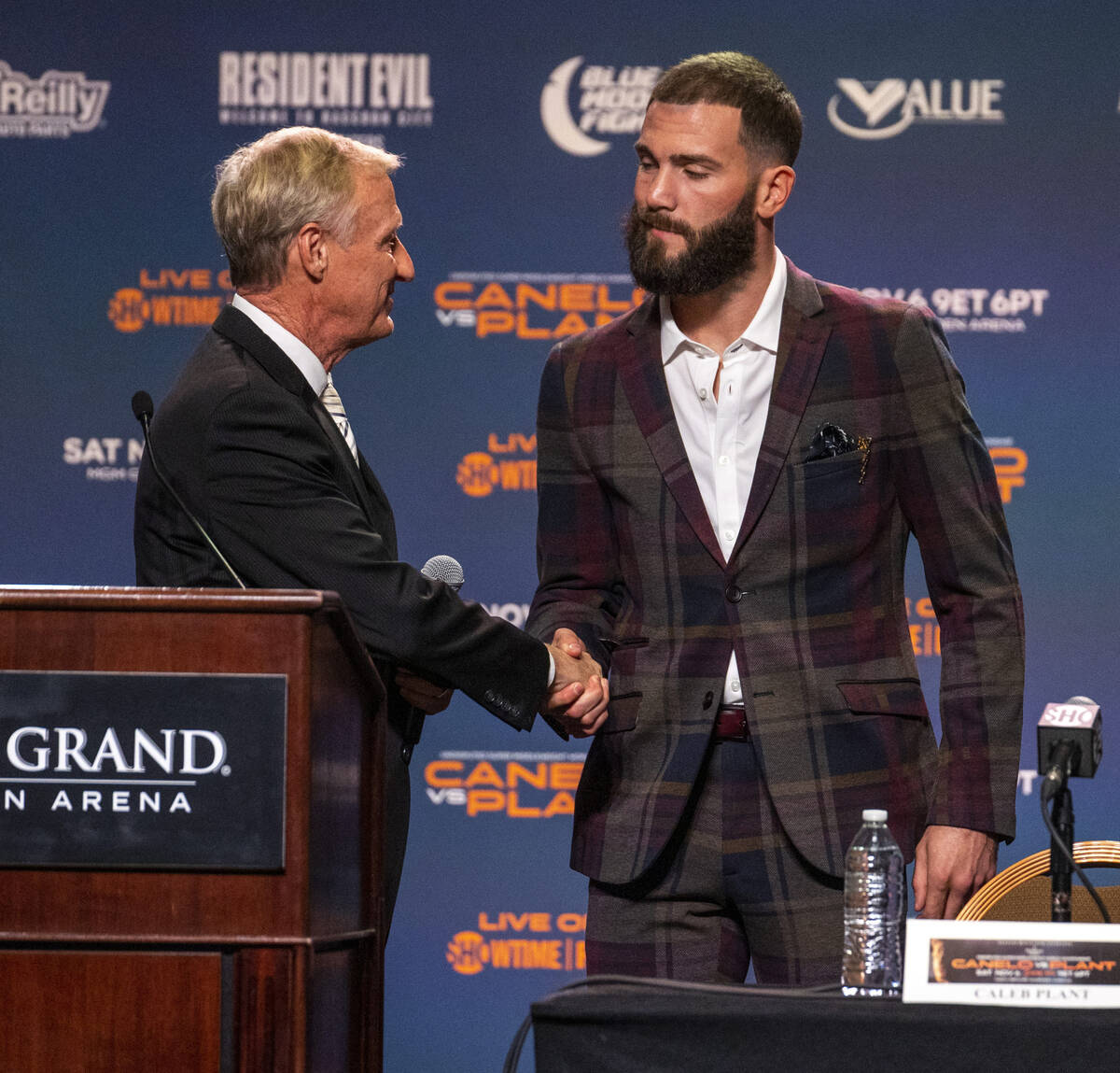 Boxing announcer Jimmy Lennon Jr., left, welcomes Caleb Plant to the stage during the final pre ...