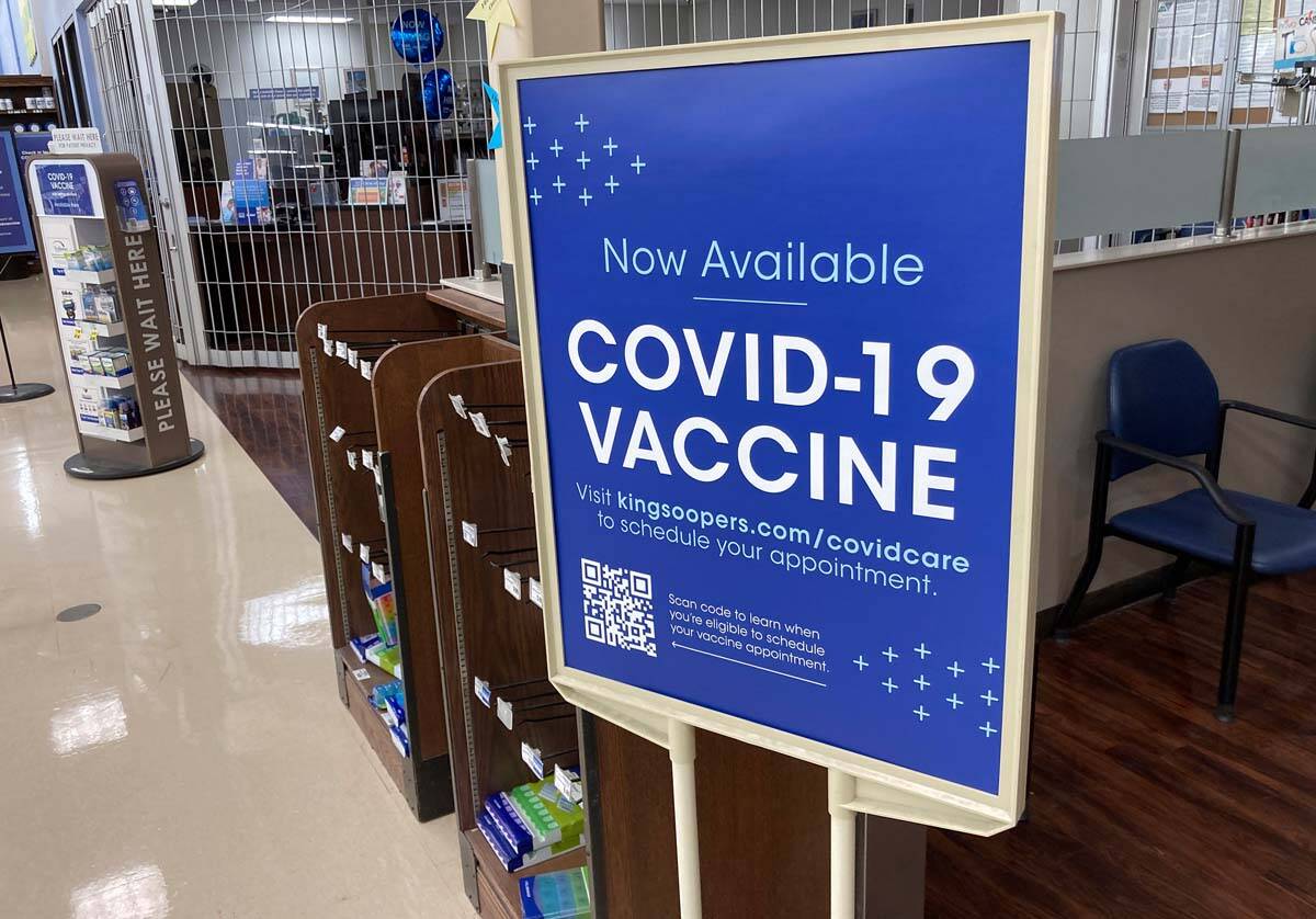 In this Saturday, Oct. 23, 2021, photograph, a sign notifies customers that COVID-19 vaccinatio ...