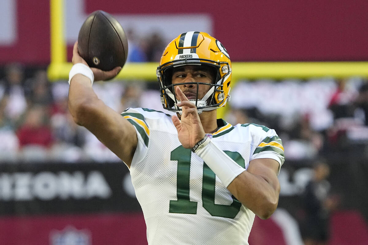 Green Bay Packers quarterback Jordan Love (10) warms up prior to an NFL football game against t ...