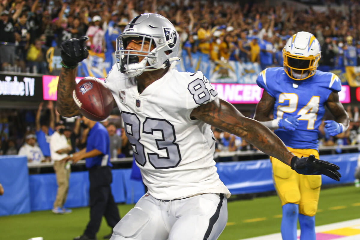 Raiders tight end Darren Waller (83) scores a touchdown against Los Angeles Chargers defensive ...