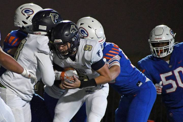 Foothill quarterback Jack Throw is sacked during a 5A region semifinal at Bishop Gorman on Frid ...