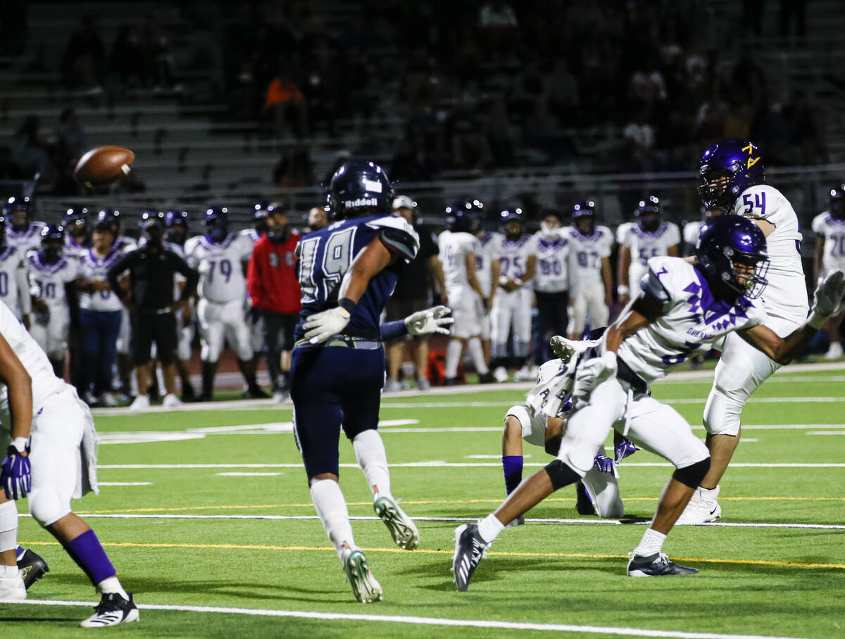 Durango's Dodge Dalke (54) kicks the ball to score a point during the first half of a football ...