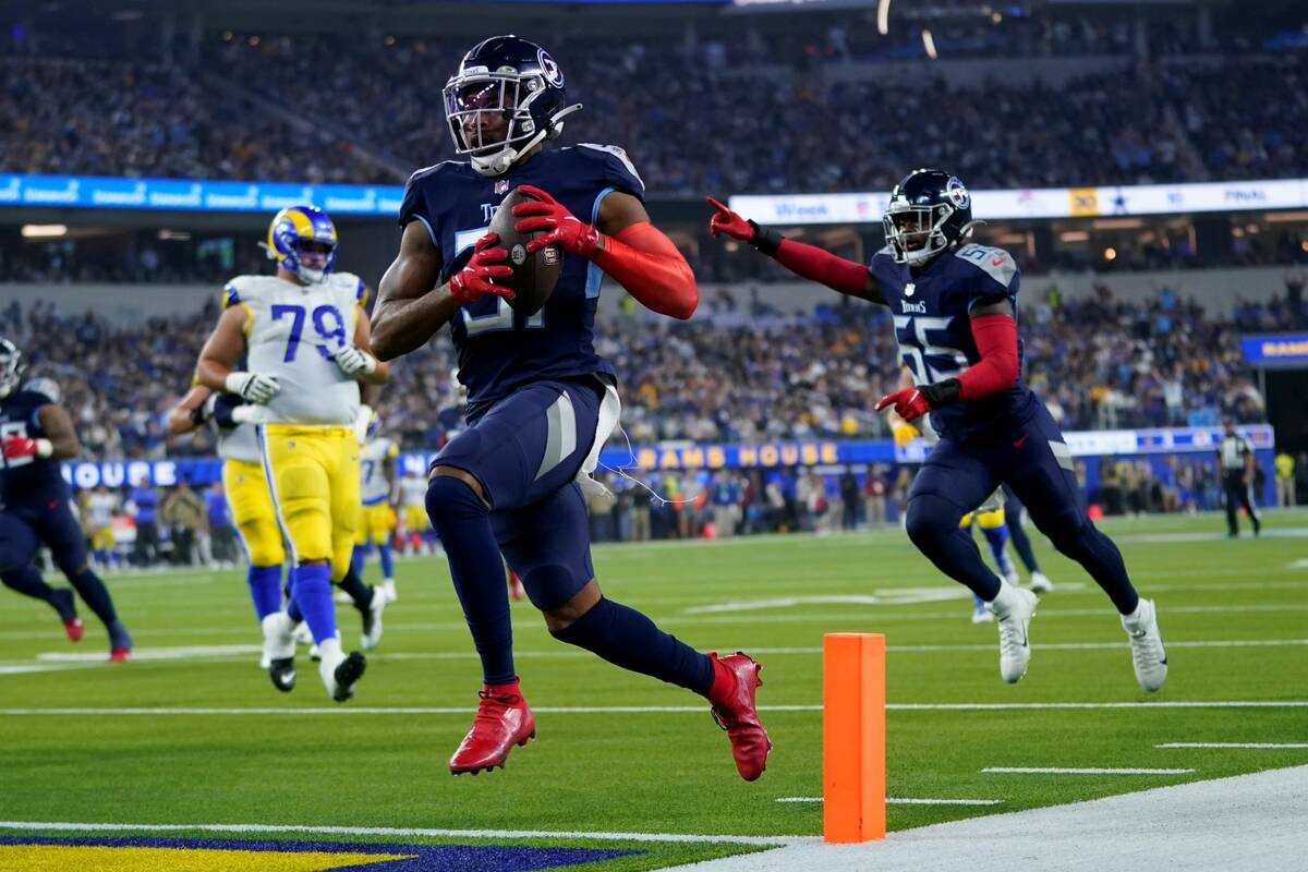 Tennessee Titans free safety Kevin Byard scores a touchdown after grabbing an interception duri ...