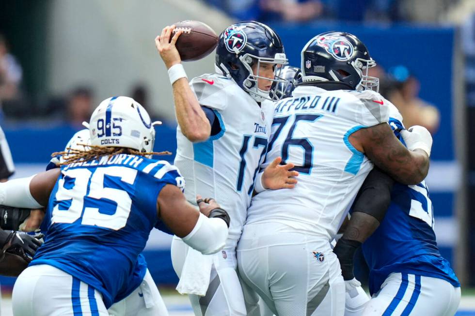 Tennessee Titans quarterback Ryan Tannehill (17) is sacked by Indianapolis Colts defensive tack ...