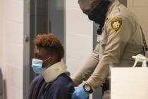 Former Raiders wide receiver Henry Ruggs is brought into the courtroom during his initial arrai ...