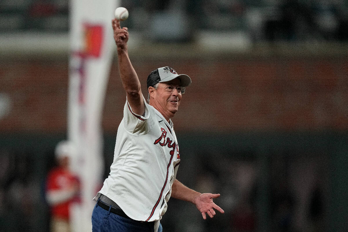 Former Atlanta Braves pitcher Greg Maddux throws out the ceremonial first pitch before Game 5 o ...