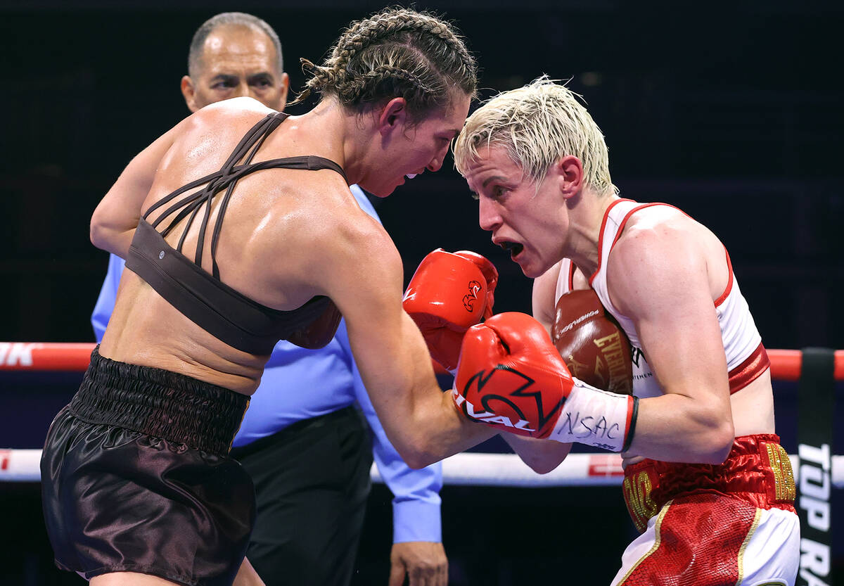 Mikaela Mayer (L) and Maiva Hamadouche (R) exchange punches during their fight for the WBO & IB ...